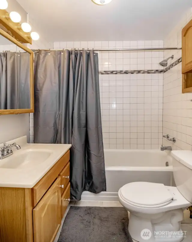 The tub surround features a beautiful tile accent and a built-in ledge that’s perfect for your shampoos, soaps, or a candlelit soak after a long day.