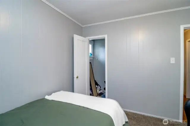Complete with a closet and soft carpet underfoot, this secondary bedroom offers comfort and functionality in one sweet space.