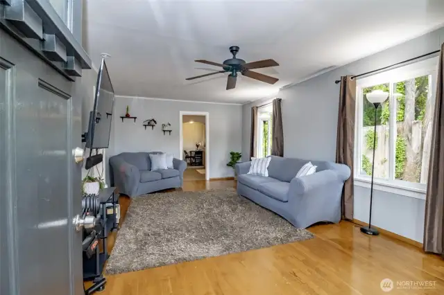Welcome in!  When you open the front door you are entering your comfy living room with large windows and lots of natural light!  Look at this beautiful hard wood floor!