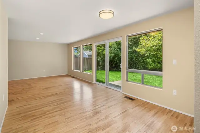 Large windows open to backyard providing an abundance of natural light.