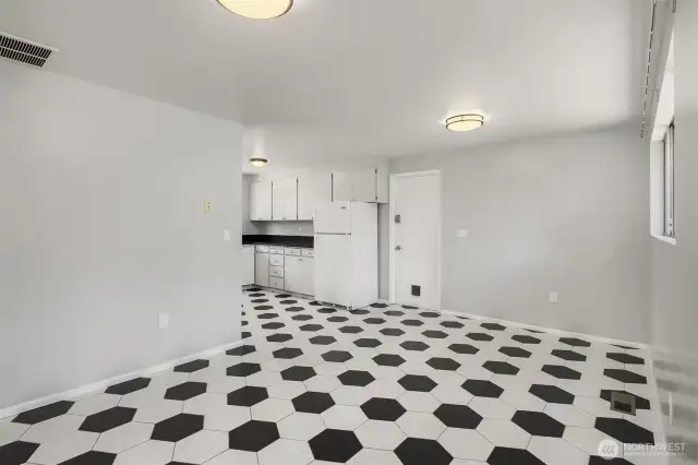 Kitchen connects to garage and laundry area.