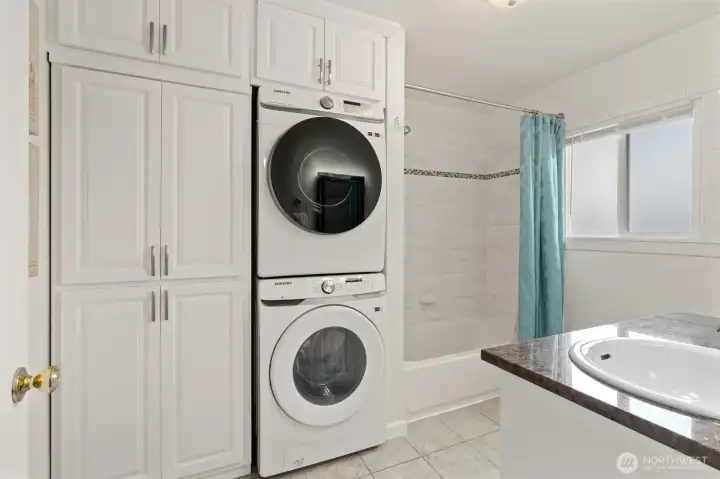 Beautifully updated tile bath surround, newer washer & Dryer with lots of storage