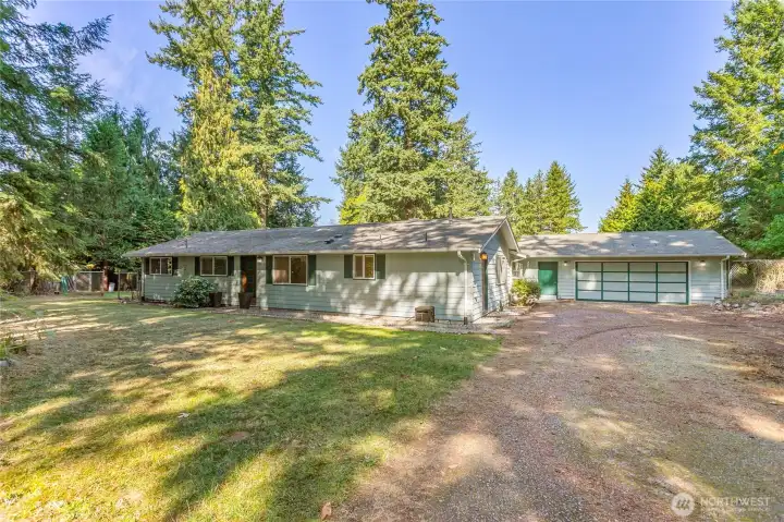 Front entry, side entry, garage entry and oversized 2 car garage with lots of extra parking on the right.