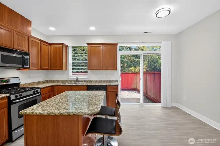 Kitchen leads to back patio/yard space