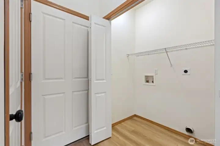 Laundry room.  Entry door to Garage and entry to lower level