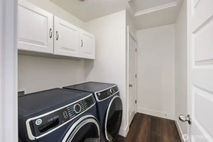 Laundry room conveniently located on upper level