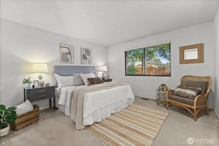 Really great sized secondary bedroom facing East, wonderful morning sunshine! All windows in the home have custom blinds and quad layered insulation