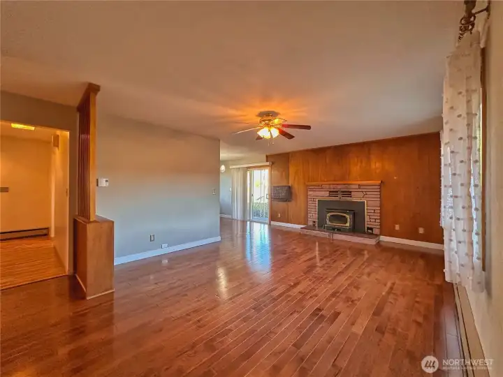 Warm, natural wood floors add warmth and character