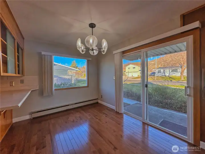 Dining room with sliding glass door to patio provides great natural light