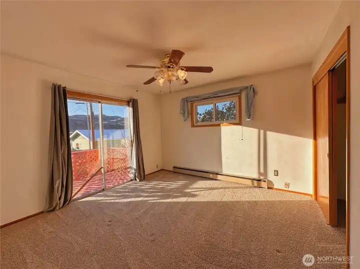 Primary bedroom with slider to backyard