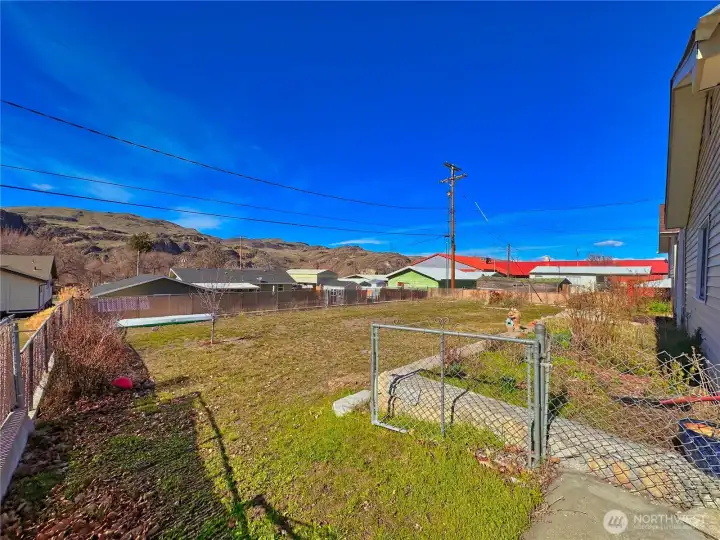 Fully fenced backyard with gated access and access from inside home.