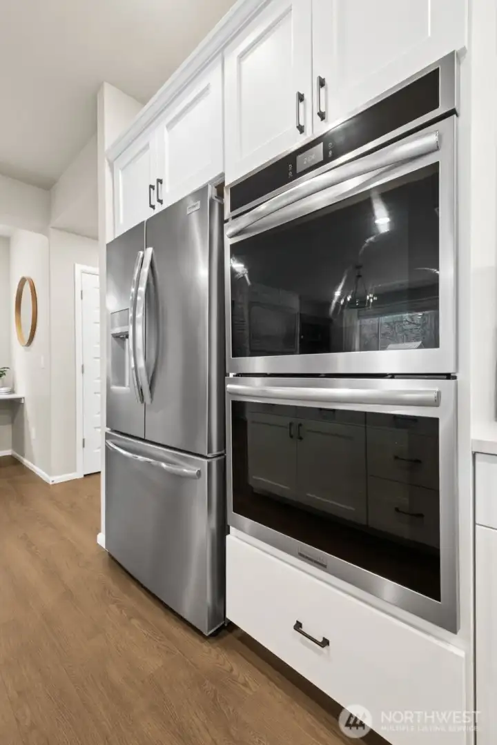A gourmet kitchen anchors the heart of the home with double ovens.