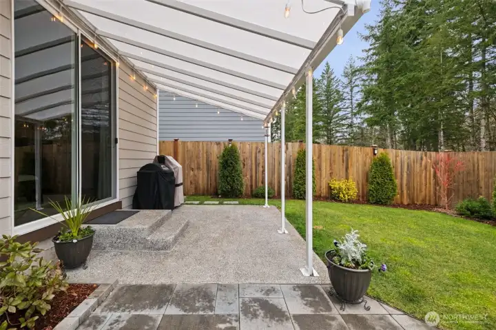 The spacious covered patio offers protection from PNW sprinkles or Summer sun. A perfect place to stash your grill!