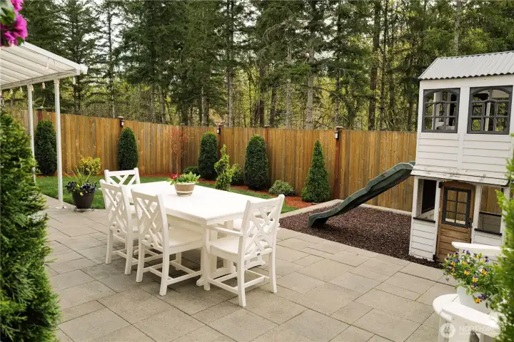 Enjoy peaceful evenings overlooking the protected greenbelt. Nature becomes part of your everyday view. Playhouse stays!