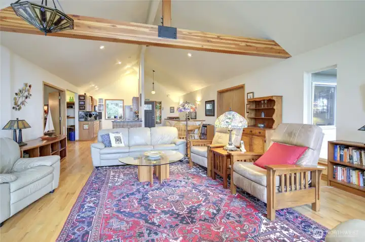 The living space is open to the dining and kitchen space.  To each side of the home there are double doors that lead to the two upstairs bedrooms.  The primary is on the left.