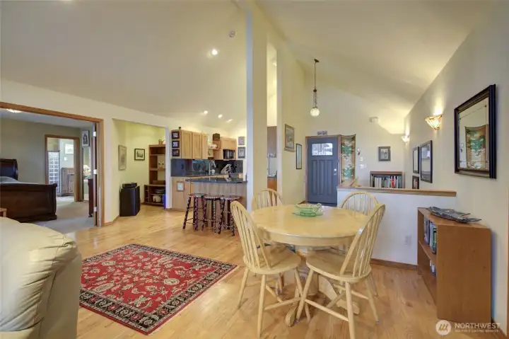 Lots of room for dining and bar space for extra seating or enjoying your coffee in the morning.  The staircase to the lower level is to the right of the front door.