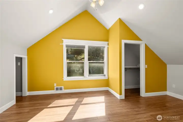 Upstairs bedroom- looks back into the woods for privacy! There is a huge closet in here plus a bonus finished area/attic space for storage or playroom!