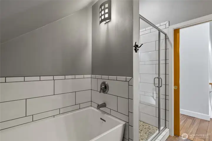 Upstairs full bath has a soaking tub & a separate shower.