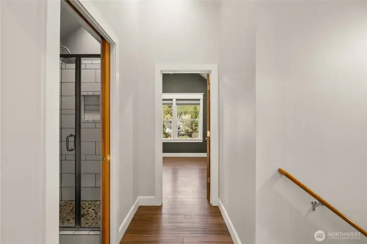 Upstairs bedroom- looks back into the woods for privacy! There is a huge closet in here plus a bonus finished area/attic space for storage or playroom!
