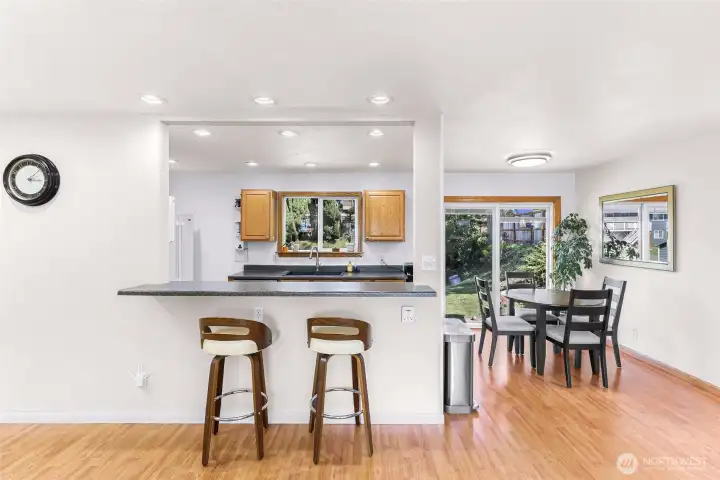 View from living room to kitchen and dining, this space lives seamlessly for gatherings and entertaining.
