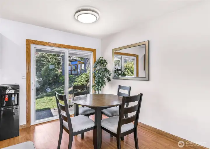Dining area with slider to back patio and large back yard
