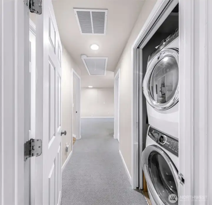 Entering the primary suite is the laundry with ensuite primary bath to the left