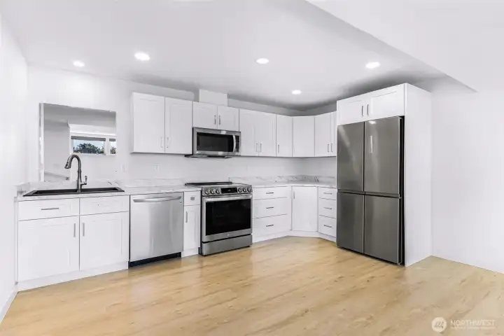 Full kitchen with all brand new stainless steel appliances and soft close cabinets