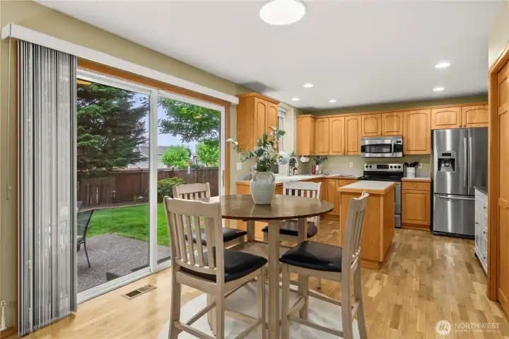 A large sliding door brings in additional natural light and frames views of the private backyard.