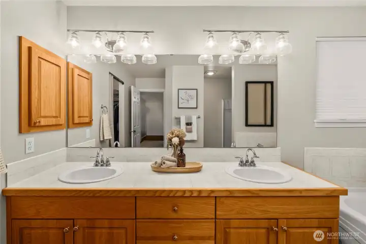 Primary ensuite featuring dual sinks