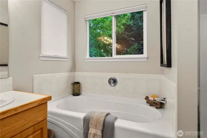 Large soaking tub perfect for relaxing and unwinding.
