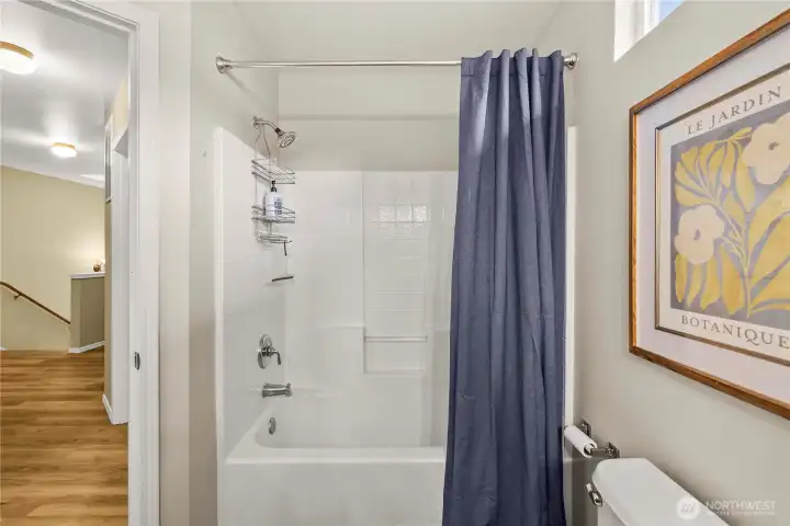 Another view of the upper-level guest bathroom highlighting its clean and functional design.