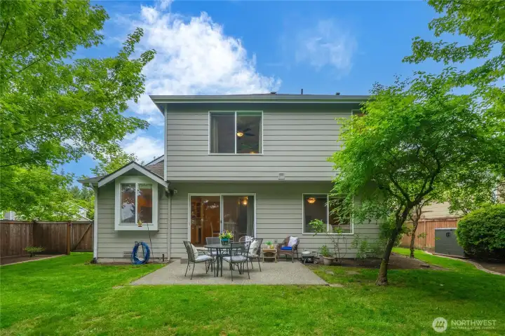 Large patio just off the sliding glass door, ideal for outdoor entertaining and gatherings.