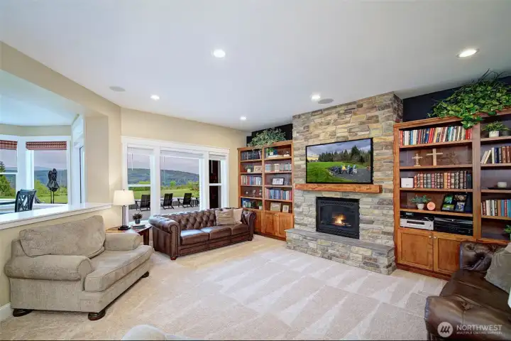 Cozy stone fireplace, solid wood mantle and the views that never get old. Cozy stone fireplace, solid wood mantle and the views that never get old.