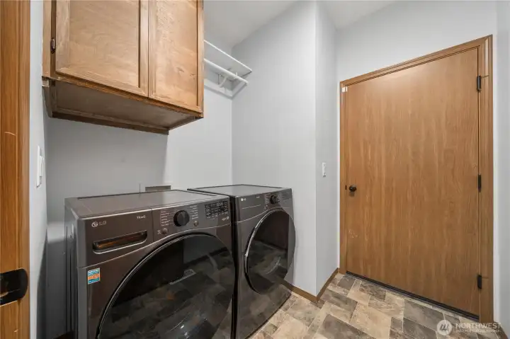 Laundry room/mud room off of the garage. Newer washer & dryer (2024)