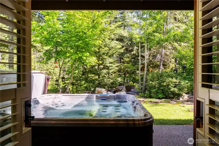 French doors to hot tub and patio from primary
