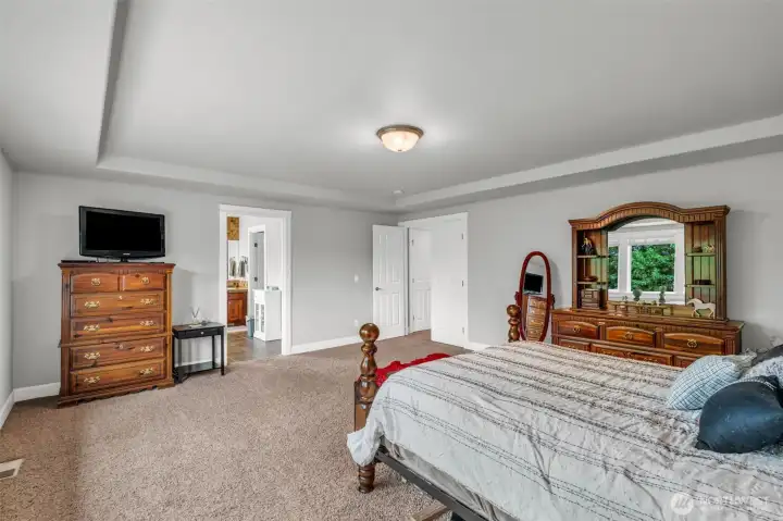 Oversized primary retreat with large windows overlooking the backyard, abundant natural light, and an open layout that creates a relaxing, peaceful atmosphere. Oversized primary retreat with large windows overlooking the backyard, abundant natural light, and an open layout that creates a relaxing, peaceful atmosphere.