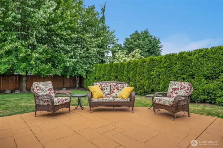 Relax with your morning coffee or evening beverage in this peaceful outdoor seating area surrounded by lush landscaping. Relax with your morning coffee or evening beverage in this peaceful outdoor seating area surrounded by lush landscaping.
