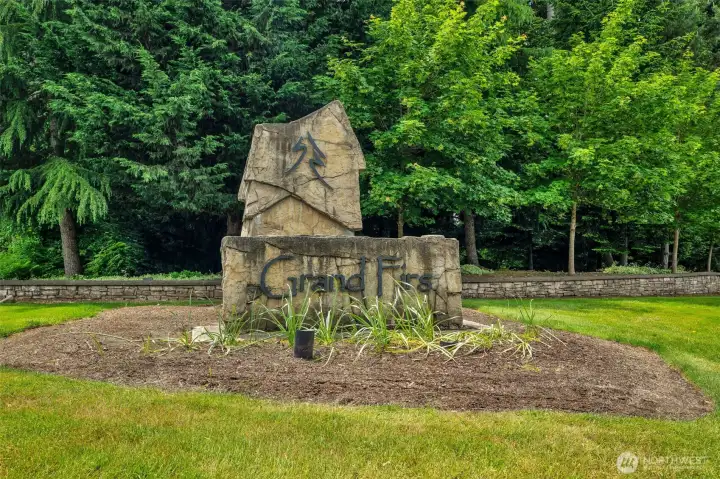 The impressive Grand Firs entrance monument and lush landscaping provide a warm welcome to this desirable gated community, surrounded by mature evergreens and natural beauty. The impressive Grand Firs entrance monument and lush landscaping provide a warm welcome to this desirable gated community, surrounded by mature evergreens and natural beauty.