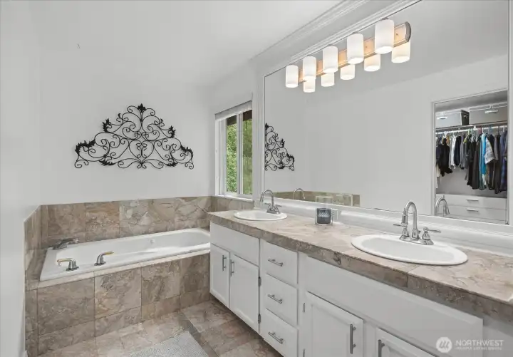 Primary bathroom has heated tile flooring.