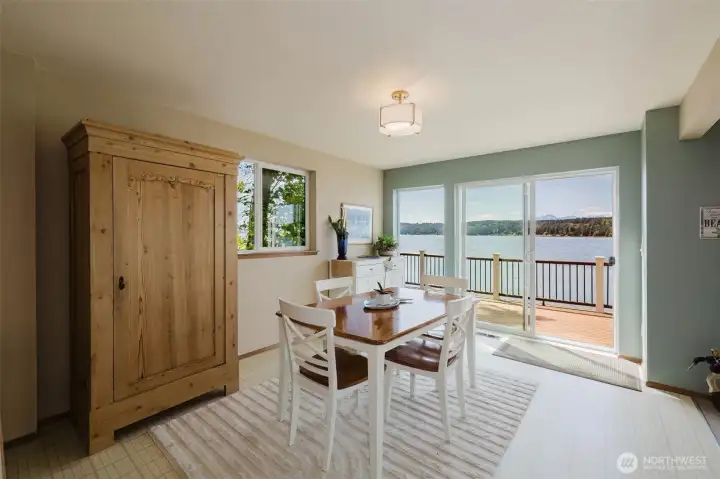 Imagine sitting down to a meal as Hood Canal sparkles just beyond the glass, the mountains stacked soft and blue on the horizon, and the deck just steps away for when the evening is too beautiful to stay inside. This dining room does not just feed you — it restores you.  Sliding glass doors open directly onto the waterfront deck, dissolving the line between inside and out and making every meal feel like an occasion. On warm evenings, simply slide them open and let the sound of the water and the salt air drift in while you linger at the table just a little longer than you planned.