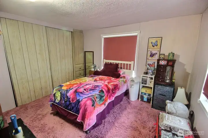 Additional bedroom with window, seating area, and flexible use for sleeping, hobbies, or storage. Additional bedroom with window, seating area, and flexible use for sleeping, hobbies, or storage.