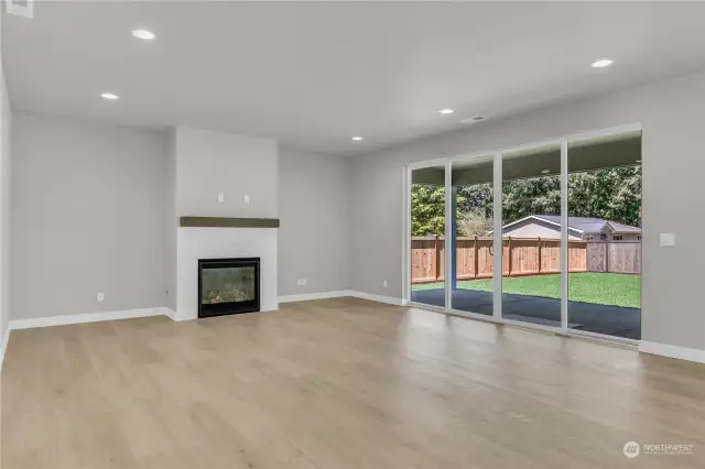 Spacious family room with a 4-panel slider, leading to covered patio!
