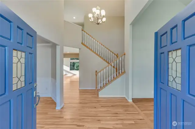 Enter the foyer on to freshly refinished hardwood floors and new paint throughout the entire home.