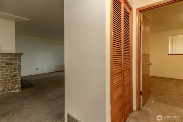 View from the primary bedroom of the hallway storage closet.  There are 2 large closets.
