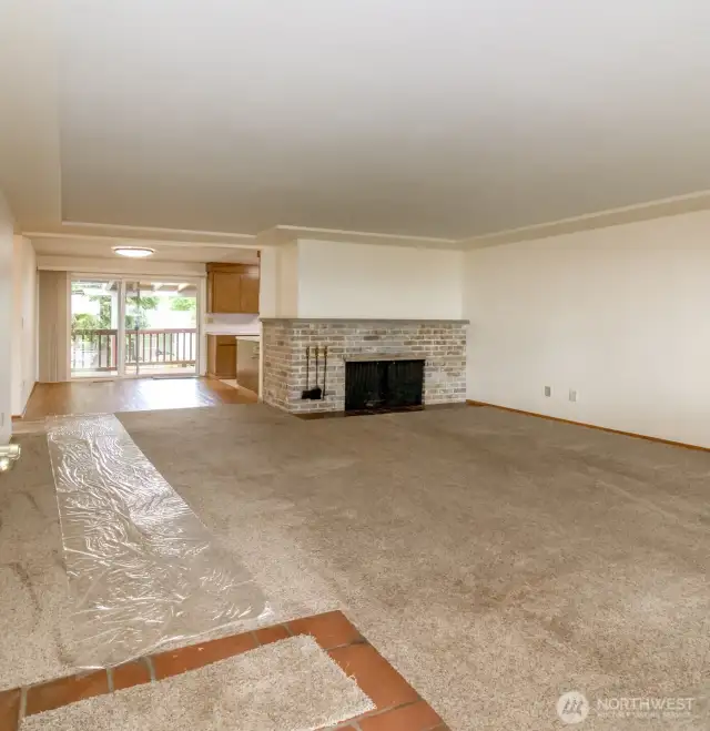 Photo from the front door, of the living room.  Real wood fireplace!