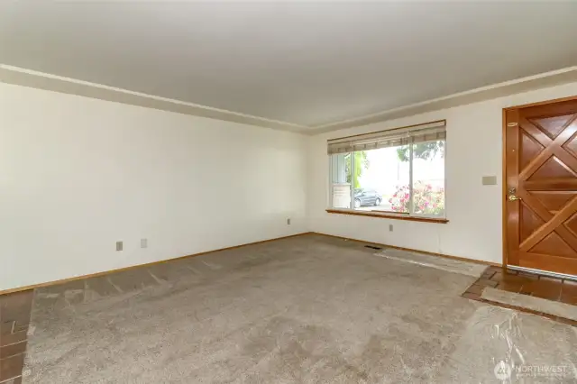 Front door and large window for lots of natural light.