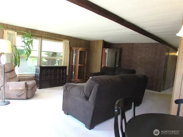 FRONT DOOR, LIVING ROOM VYNAL WINDOWS LET THE NATURAL LIGHT IN.