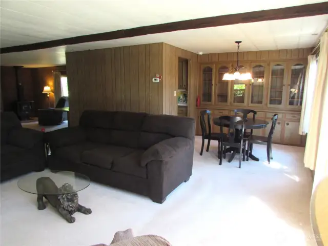OPEN FLOOR PLAN , FRONT WINDOWS OVER LOOK STRRET W/ MATURE LANDSCAPING.