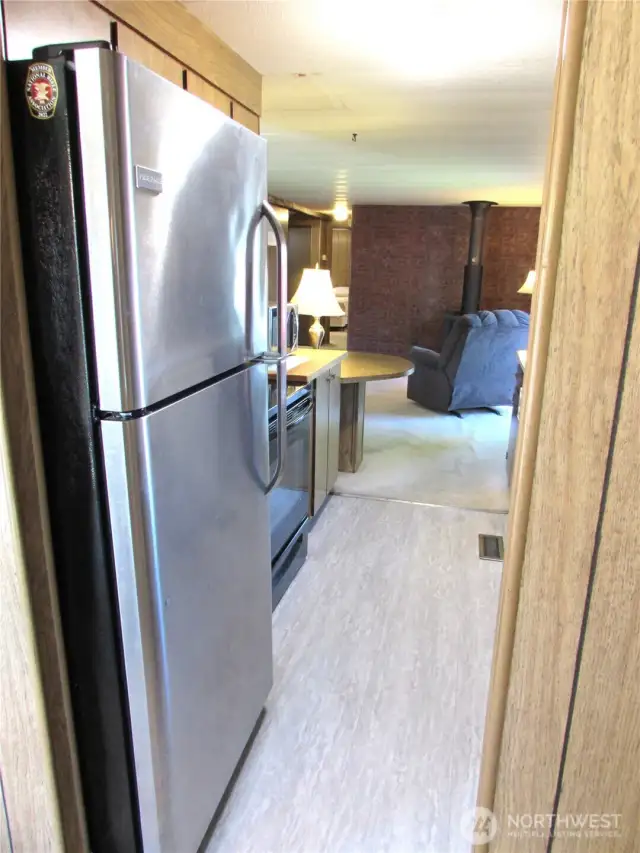 KITCHEN ENTRY FROM DINING ROOM AREA.