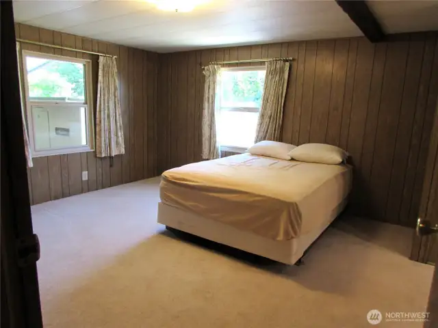 LARGE PRIMARY BEDROOM AT END OF HALL.